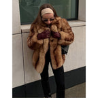 Women's short coat made of faux fur, warm and comfortable.