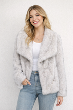 Elegant women's coat made of warm, fluffy faux fur