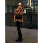 Women's short coat made of faux fur, warm and comfortable.